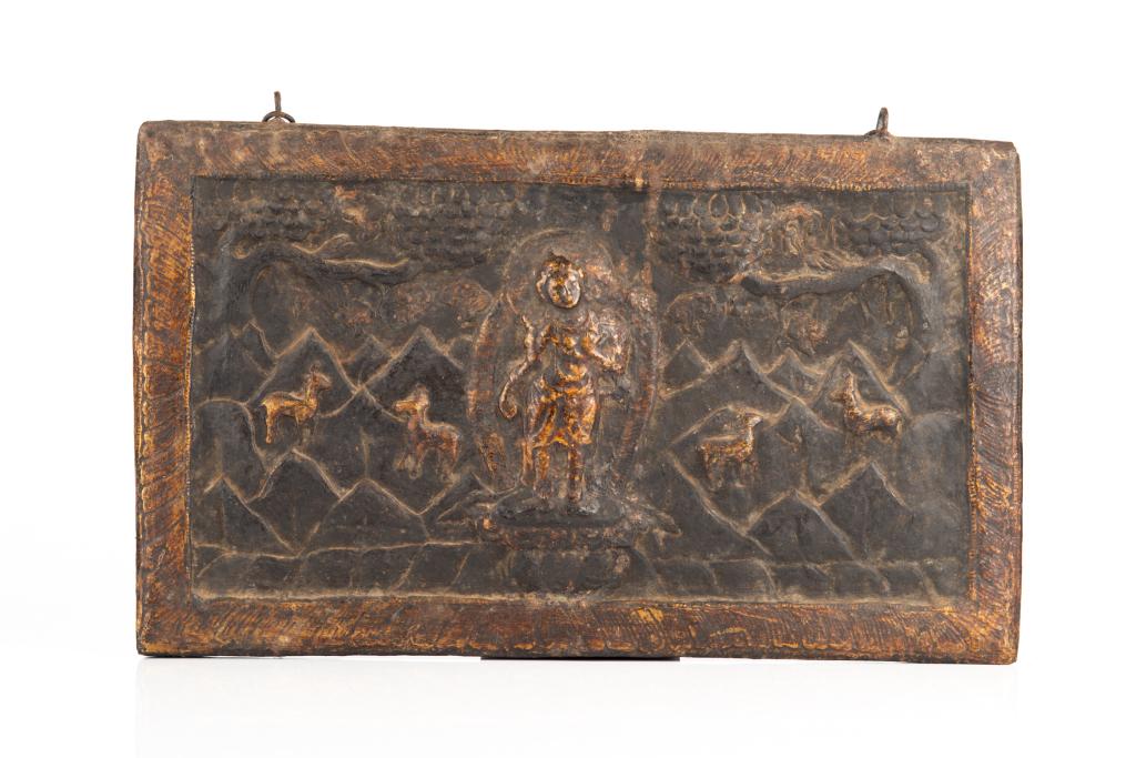 LARGE 18TH C. NEPALESE BRONZE PLAQUE: With a female deity to center against a landscape dotted by deer. Bordered by a band of lotus petals. Backed by wood. 18th C. Size: 46.3 x 27.3cm (18 1/4 x 10 3/4 in.)