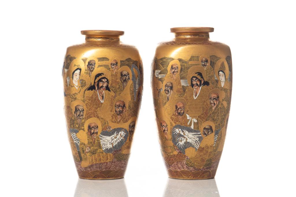 PAIR OF JAPANESE SATSUMA POTTERY VASES: Painted with figures to exterior. Base marked Hodota. Meiji period. H. 31cm (12 1/4 in.)