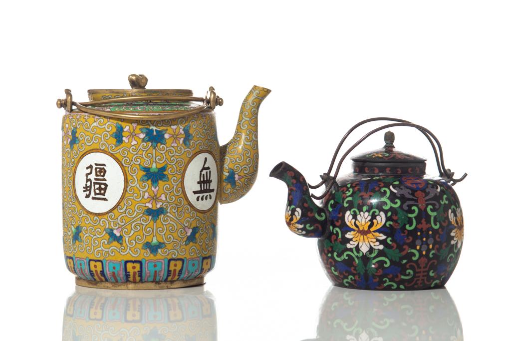 TWO CHINESE CLOISONNE TEA POT: One with enameled multi- color flowers and leaf on black ground. The other decorated with four Chinese characters "Wan Shou Wu Jiang" around the body with flower and leaf scroll on yellow ground. Qing
