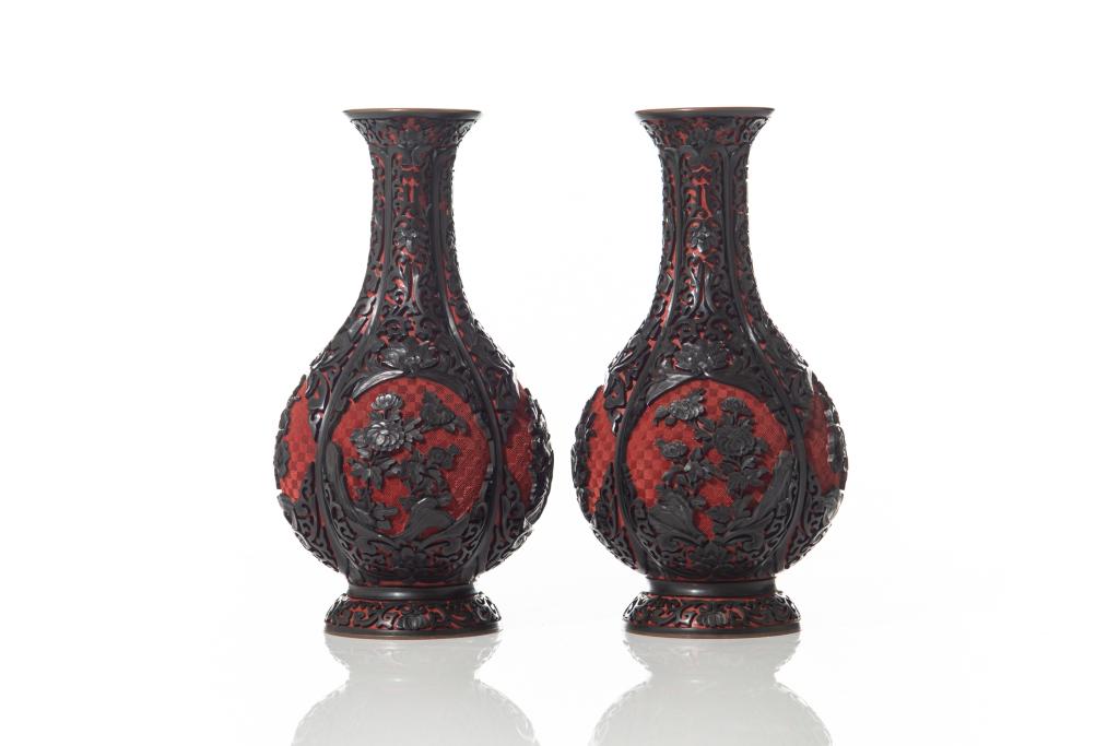PAIR OF BLACK ON CINNABAR LACQUER VASES: Carved black floral motifs surrounded by lotus lappets on cinnabar lacquer ground. H. 26cm (10 1/4 in.)