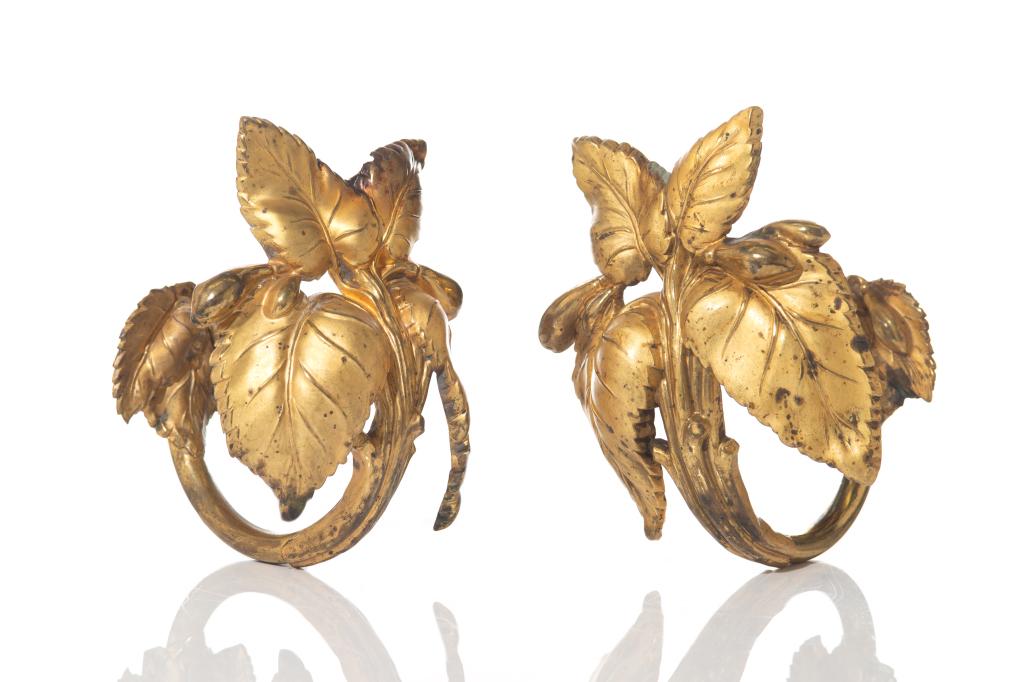 PAIR OF BRASS GILDED LEAF FORM CURTAIN TIE BACKS: W. 6 in. Restoration noted.