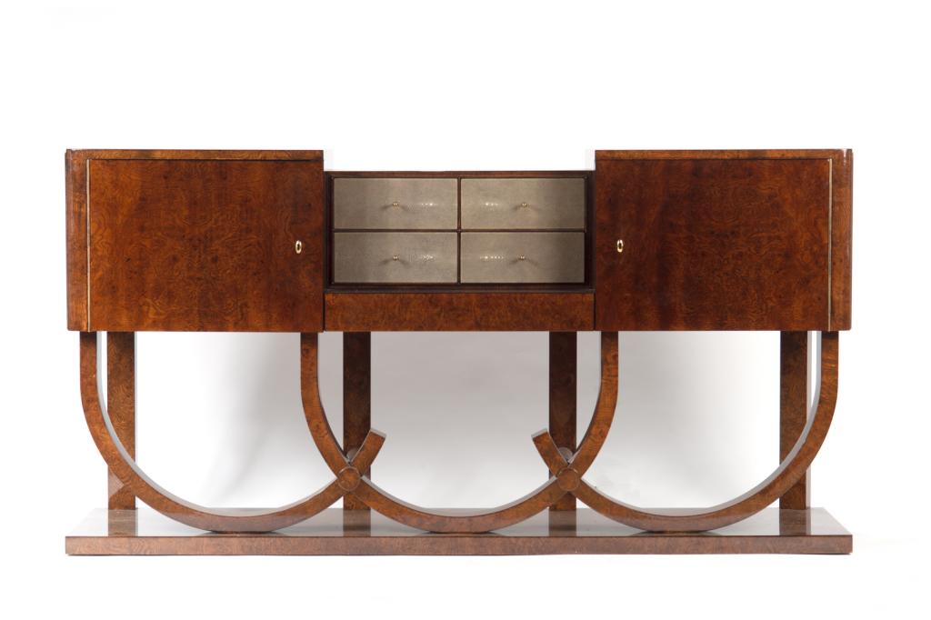 ART DECO STYLE BURLED WALNUT SIDEBOARD: Made with Amboyne burl wood, with central four drawers accented in silvered shagreen veneer and the upper cabinets raised on bentwood style rounded feet. H. 37 1/4 W. 71 3/4 D. 19 3/4 in.