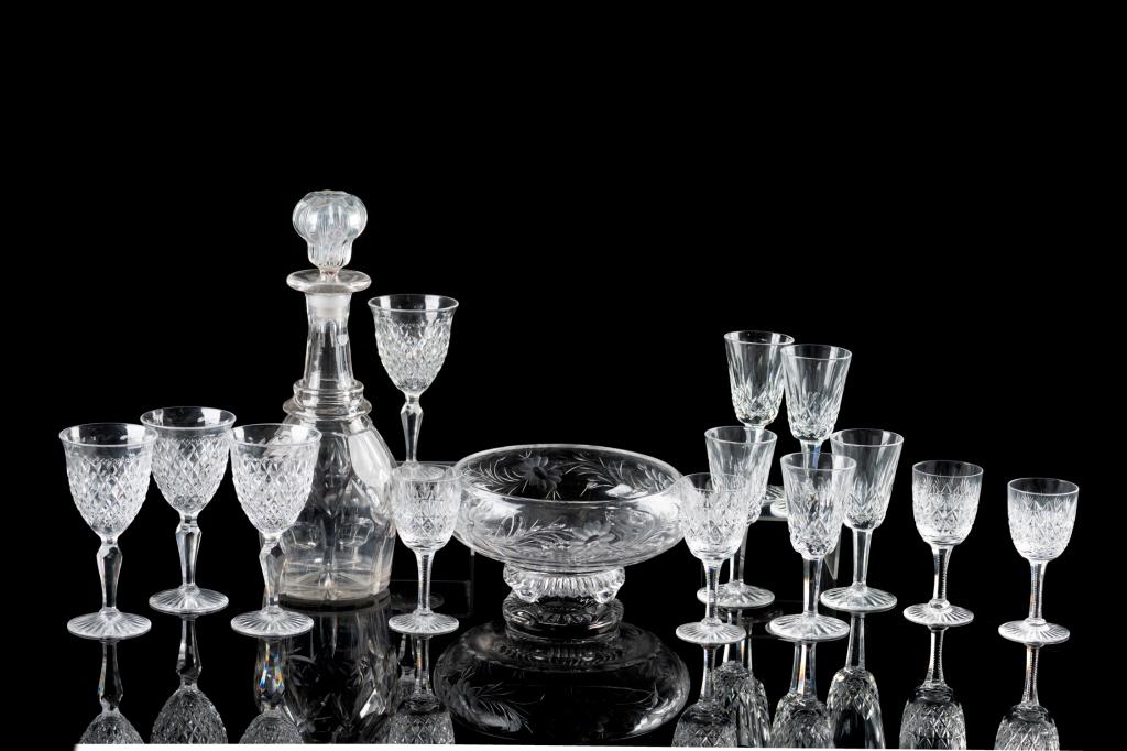 PRESSED GLASS STEMWARE AND BAR ACCESSORIES: 15 pieces total in collection, including: - Five Waterford Sherry glasses - Eight assorted stem wine and liqueur glasses - One footed bowl with floral pattern by Stuart England - One decanter with sto
