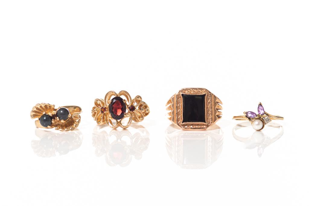 FOUR VINTAGE GOLD RINGS, 14g: Including: One yellow gold band set with two black pearls. Stamped 14k. Size 5 One slim yellow gold band set with one pearl, one small diamond and two amethysts. Stamped 14k. Size 5.75 One rose gold b