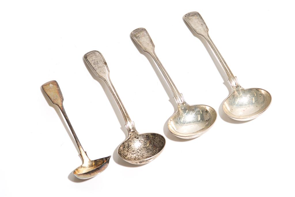 FOUR SILVER LADLES 275g: Three Victorian spoons (marked London, 1876) and one provincial, likely Scottish, silver marked cream ladle. Struck three times IS and once WS L. of largest 18 cm (7 1/8 in) Weight: 275g