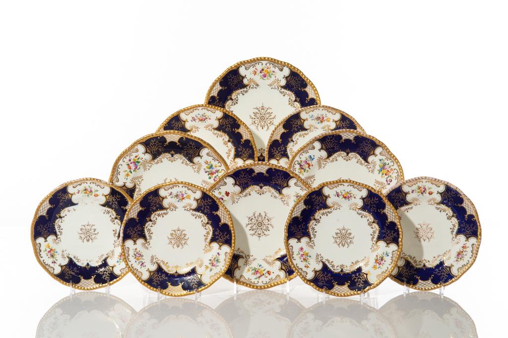 THIRTY COBALT & FLORAL PAINTED COALPORT DISHES: English porcelain dinnerware, circa late 19th century. Stamped on the bottom of each with makers mark. Collection includes: 2 dinner plates, 10 luncheon plates, 10 salad plates, 10 rimmed soup bowls. 