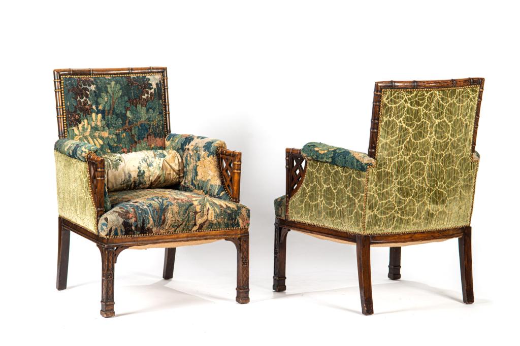 PAIR OF FRENCH FAUX BAMBOO BERGERE CHAIRS: The armchairs with antique tapestry upholstery. Pillow not included H. 37 W. 25 D. 23 in.
