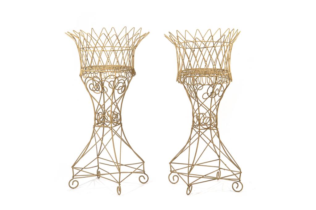 PAIR OF ANTIQUE WIREWORK PLANTER BASKETS: Painted metal wire round baskets in woven style on quadrilateral bases.H. 37 1/2 in. Dia. 19 in.