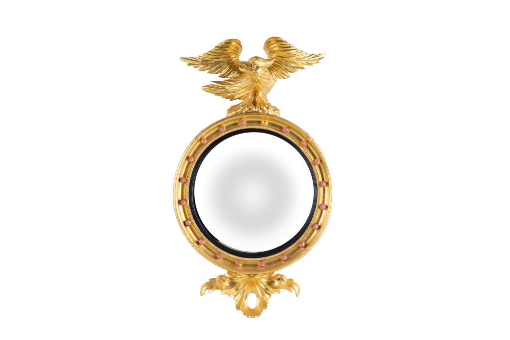 FEDERAL STYLE CARVED GILTWOOD MIRROR: Circular mirror with eagle finial and ebonized border. H. 35 1/2 x W. 21 in