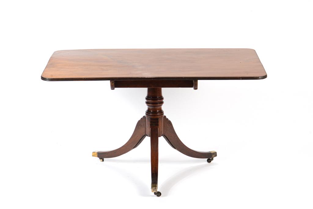 GEORGE III MAHOGANY TILT TOP BREAKFAST TABLE: Single panel with reeded edge and pedestal base. H. 27 1/2 in W. 50 1/2 in D. 32 1/2 in