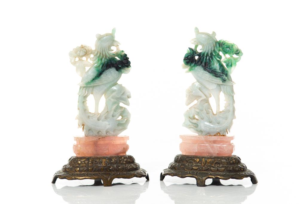 PAIR OF CHINESE JADEITE & ROSE QUARTZ BIRDS: Finely carved as phoenix on a rose quarz base all supported by a metal base. Jadeite carving late Qing dynasty. H. 21cm (8 1/4 in.) Condition report available upon request.