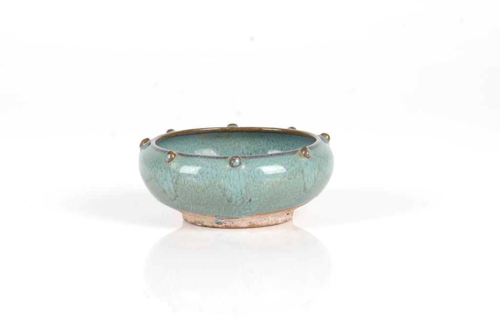 FLAMBE GLAZED CERAMIC WASHER: The circular turquoise glazed washer with drum form studs near the rim. Top dia. 8cm (3 1/8 in.) Condition report available upon request.
