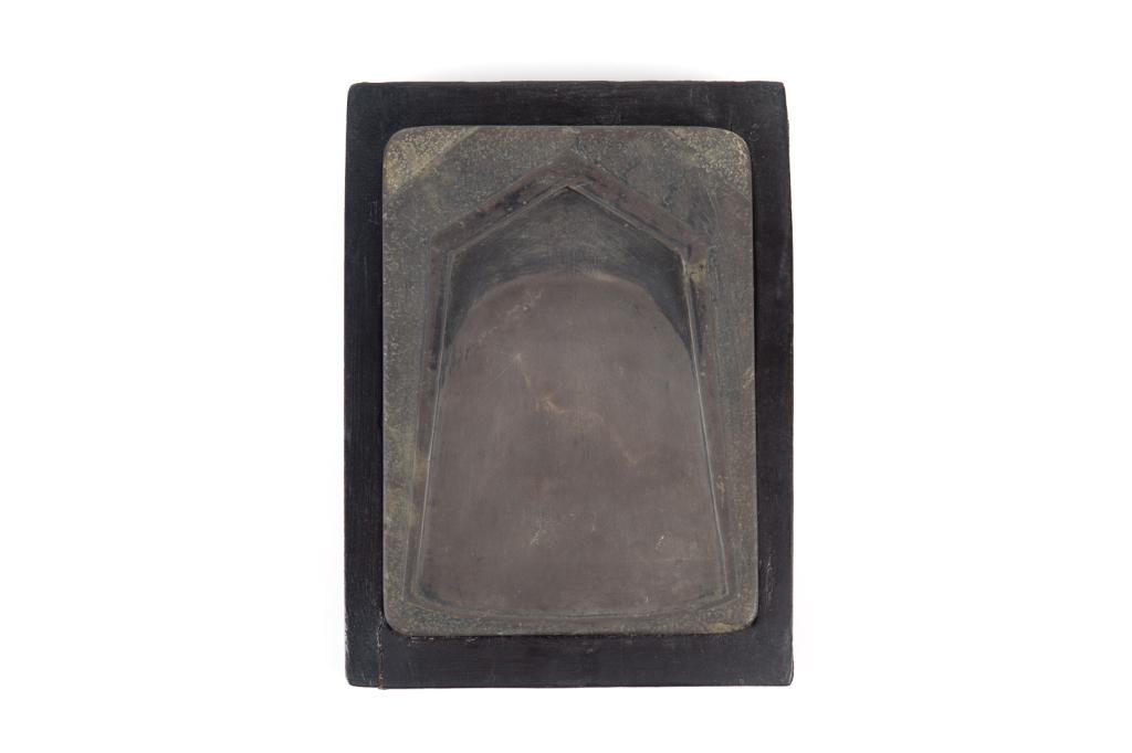 CHINESE SCHOLAR'S INKSTONE & WOOD BOX: Inkstone surface and well carved in the form of an axe blade. Stone size: 14.3 x 10.3cm (5 3/4 x 4 1/4 in.) Box size: 18 x 13cm (7 x 5 in.) Condition report available upon request.