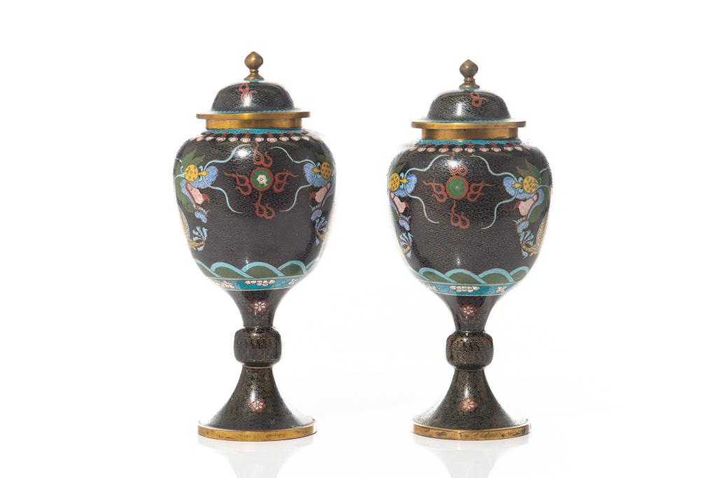 PAIR OF CHINESE CLOISONNE COVERED STEMMED JARS: Two black jars with gold detailing and yellow dragon design. Height: 31cm (12.2 inch.) Condition report available upon request