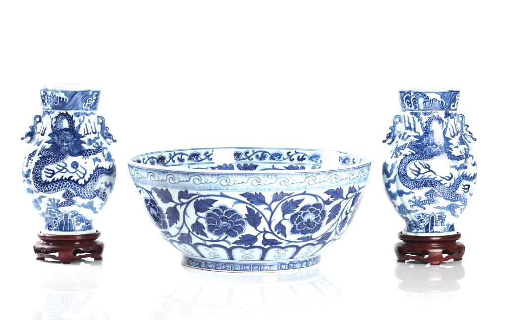 PAIR OF BLUE & WHITE PORCELAIN VASES & LARGE BOWL: The porcelain bowl painted in Ming dynasty style with flower scrols and wave bands. Base with six character Xuande mark, 20th C. Bowl dia. 40cm (15 5/8 in.) The pair of vases painted with dragonschasi