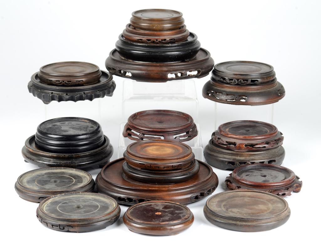 GROUP OF TWENTY CHINESE CIRCULAR WOOD STANDS (1 of 4)