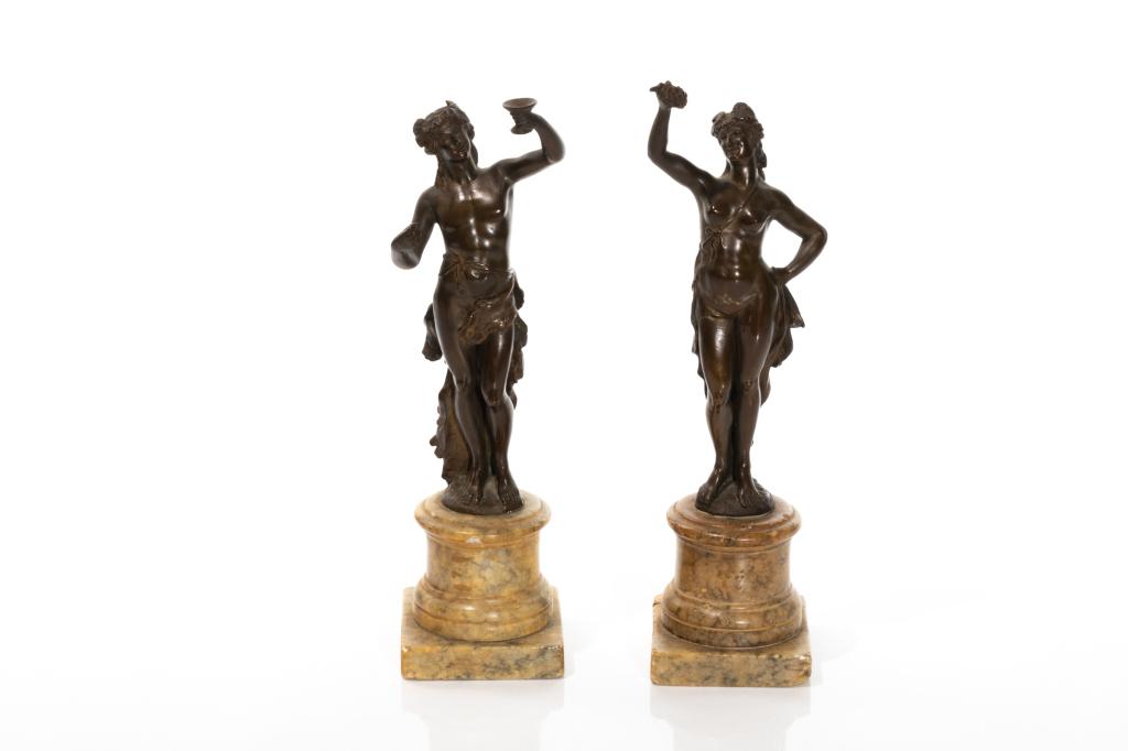 PAIR OF BACCHANALIAN BRONZE FIGURES: Of standing male and female figures holding grapes and a chalice, standing on alabaster bases, possibly 19th C Grand Tour. Total H 28cm (11in) Condition Report Unmarked, crack to leg of thefemale, unk