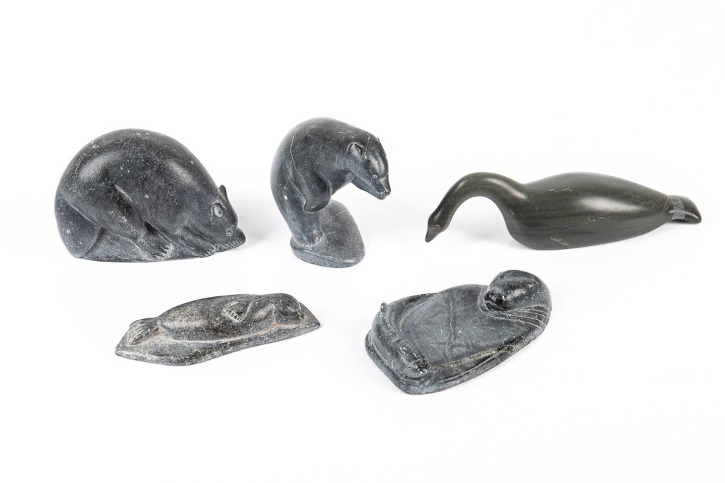 FIVE SOAPSTONE INUIT SCULPTURES: LIZZIE CROW (b. 1948) Umiujak E9247 Grey-green stone figure of a resting bird. L. 18 cm (7 in.)TIOMTI Grey stone animal figure. L. 12 cm (4 3/4 in.) POSSIBLY SAMISA PASSAURLU IVILLA PuvirnituqE9806 Gr