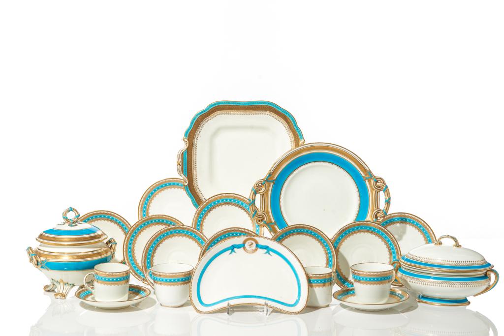 GROUP OF TURQUOISE ACCENTED PORCELAIN: Including two Minton cake plates. Together with a small tureen and cups and saucers. Size: 25.4 x 26.7 cm (10 x 10 1/2 in.)