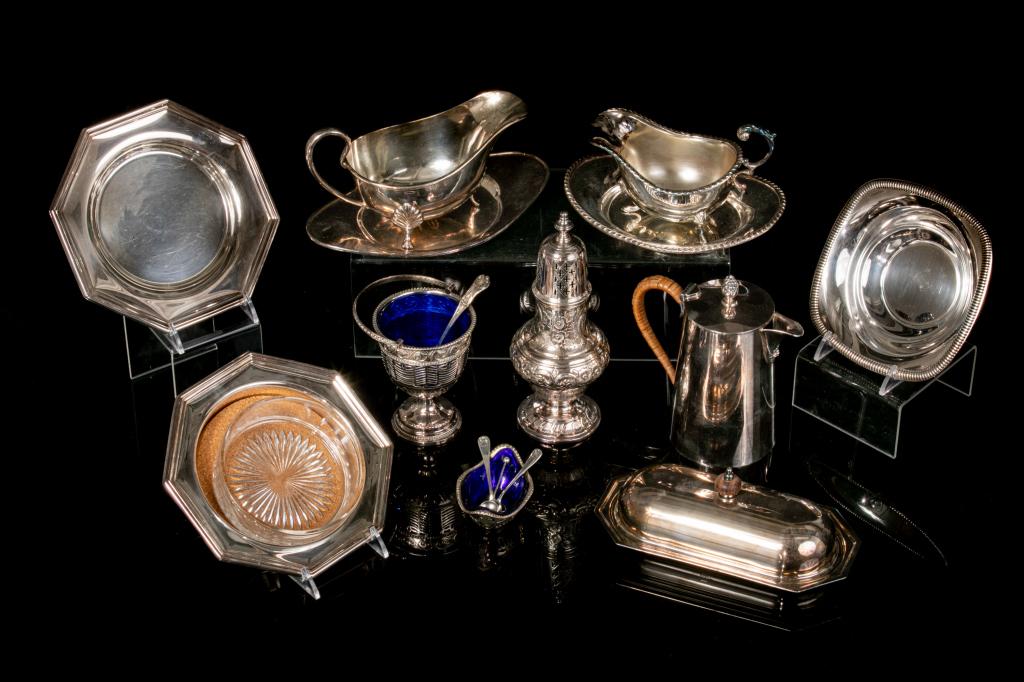 GROUP OF ASSORTED SILVERPLATE TABLE ACCESSORIES: Including: - a cobalt blue glass lined salt with spoon - a cobalt blue glass lined serving goblet with handle and spoon - a wicker woven handled Sheffield coffee pot- two footed gravy boats - one cove