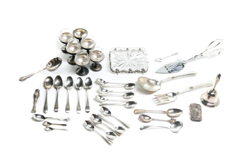 GROUP OF ASSORTED SILVER WARE & TABLE ACCESSORIES: Comprising: 21 various small sterling spoons, one small seal stamp with M monogram, one pair of silver handled serving utensils, two small salt spoons, one match case, one pair of serving tongs, one c