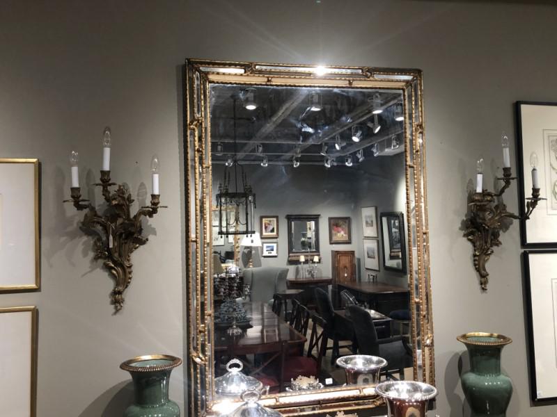 PAIR OF FRENCH BRONZE WALL SCONCES: In the Louis XV manner.