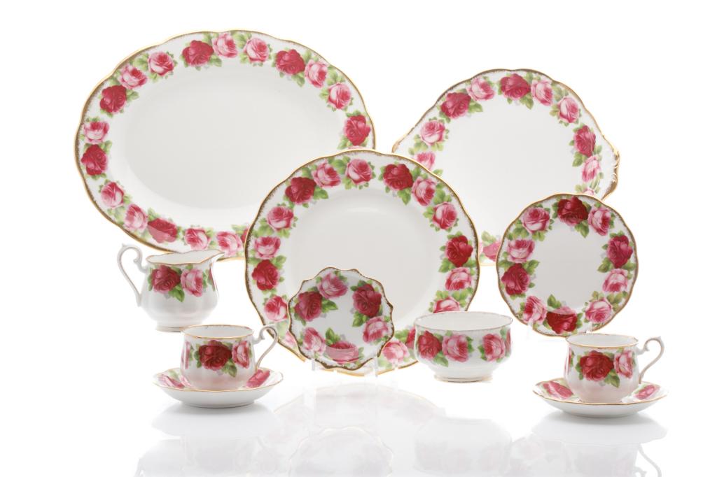 22 PCS ROYAL ALBERT OLD ENGLISH ROSE SERVICE: With large pink roses, white ground, and gold brush edges. Comprising: six footed cup and saucer, six bread and butter plates, six dinner plates, cream and sugar, one oval serving platter, and one bon