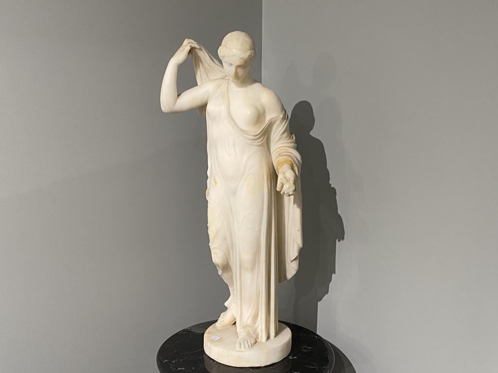 CARVED ALABASTER STANDING CLASSICAL FIGURE: After "Aphrodite of Frejus" or "Venus Genetrix" from a Roman copy of a lost Greek work. Unsigned, probably Grand Tour. H. 61 cm (24 in.)