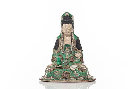 CHINESE FAMILLE VERTE BISCUIT PORCELAIN GUANYIN: 清康熙 素三彩觀音 Guanyin seated, wearing a long robe and holding a cup in one hand. Face and chest showing marbleized glaze. Qing dynasty, Kangxi
