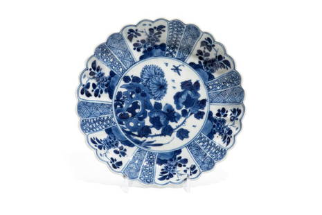 CHINESE KANGXI BLUE & WHITE PORCELAIN DISH: 清康熙 青花洞石花卉紋花口盤 Chrysanthemum form dish painted with flower and geometric patterns. Qing dynasty, 18th C. 
