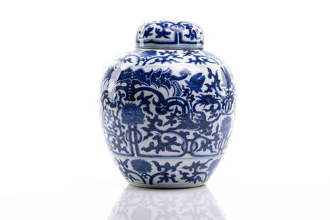 CHINESE BLUE & WHITE PORCELAIN COVERED JAR: 晚清 青花穿花龍紋蓋罐 Painted with stylized dragons, bats, and floral scrolls. Qing dynasty, 19th C. H. 21.5cm (8 1/2 in.)