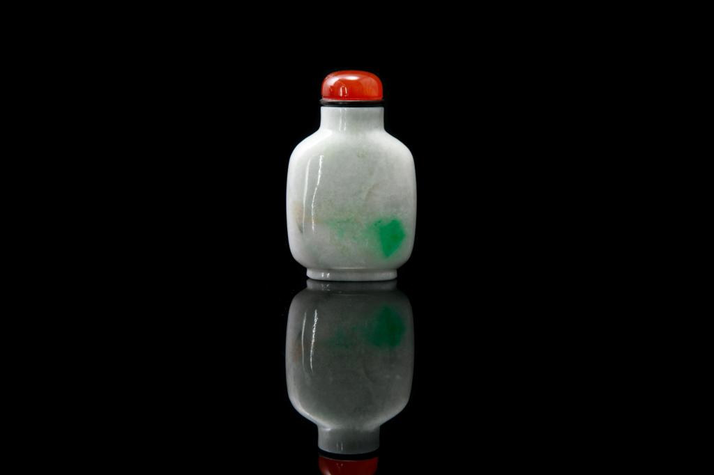 CHINESE JADEITE SNUFF BOTTLE: 晚清 翡翠鼻煙壺 Overall in white tone with some apple green inclusions to one side. Agate stopper. Late 19th to early 20th C. Agate stopper. H. including stop