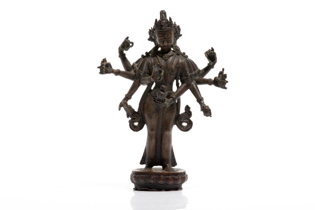 19TH C. NEPALESE BRONZE AVALOKITESHVARA: 十九世紀 尼泊爾銅觀音 In the Amoghapasha (Unfailing Lasso) iconography with eight arms with six holding ritual implements, standing on a lot