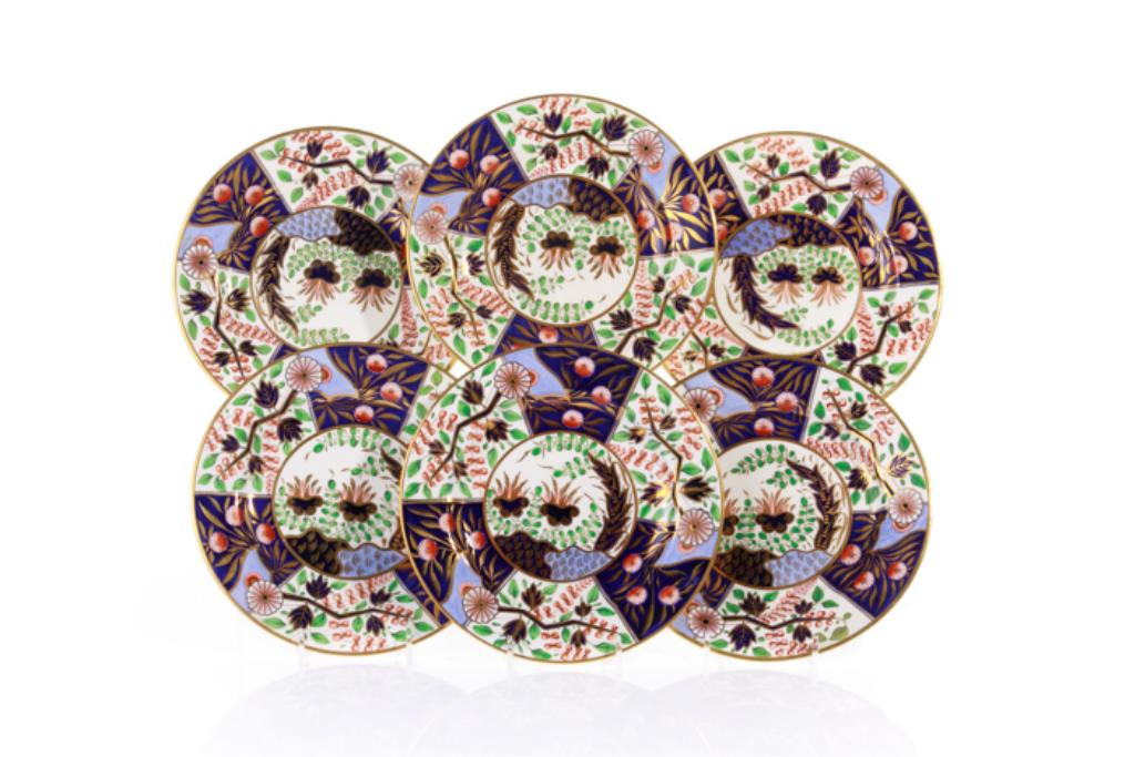 SIX EARLY 19TH C SPODE BREAD & BUTTER PLATES: Hand painted Spode Imari bone china large saucers, pattern 2251. With a complex pattern of flowers and leaves in cobalt, light blue, greens, reds, and gilded details. Possibly from the Josiah Spode II