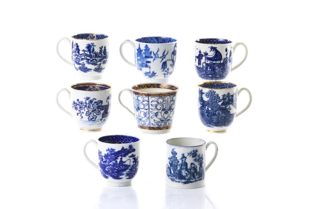 EIGHT 18TH C BLUE & WHITE PORCELAIN COFFEE CUPS: Assorted porcelain coffee cups with blue and white decoration, some transferware, some hand painted, some with gilding. Including Worcester "Royal Lily" coffee can, c.1785-1790; a Caughley coffee cup 