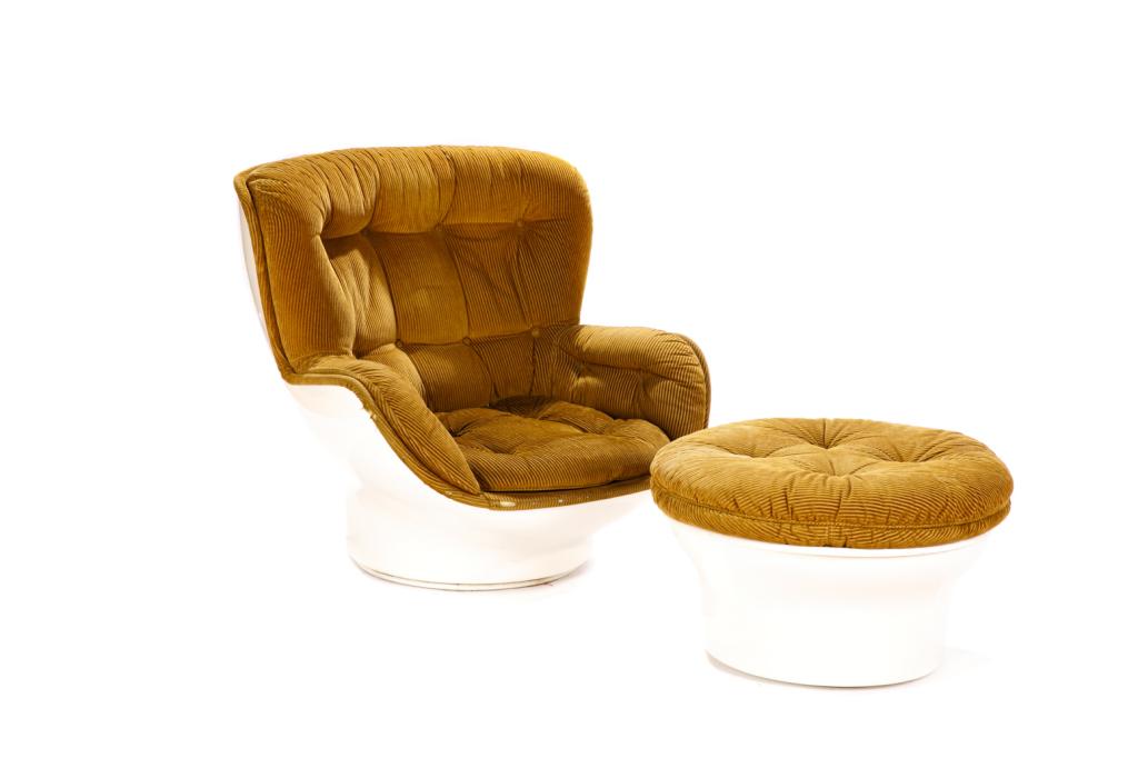 MICHELLE CADESTIN FIBRE GLASS KARATE CHAIR: With matching ottoman. Mustard corduroy upholstery on fiberglass frame. H. (chair) 35 W. 37 in