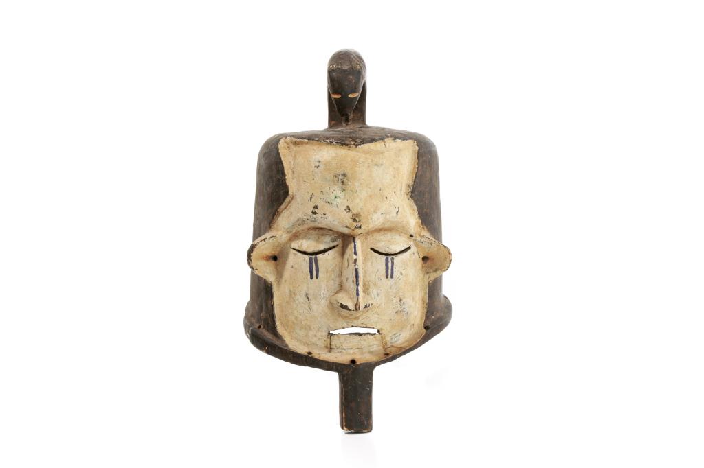 AFRICAN PAINTED HELMET MASK WITH ZOOMORPHIC CREST: Possibly from Ivory Coast, similar to Senufo Degele style with full pull over helmet and finial atop the head. Figural carving on the top depicts a four legged animal. Main face is painted white with