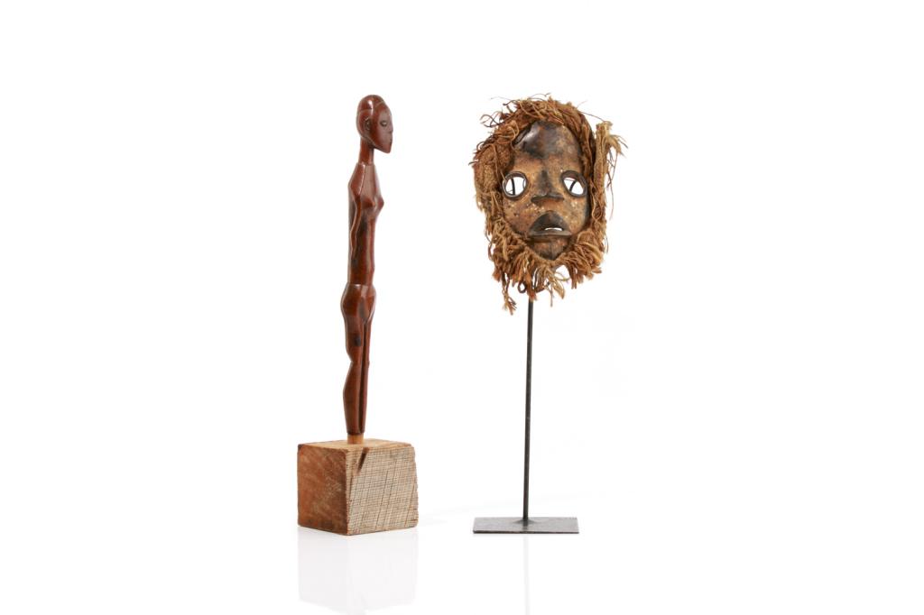 AFRICAN TRIBAL MASK & CARVING OF A FEMALE FIGURE: Including a Mumuye style slender figural sculpture with wood block base, Nigeria. Elongated torso, with polished sleek finish on the body. H. of figure without base 40 cm (15 3/4 in)Together with a ca