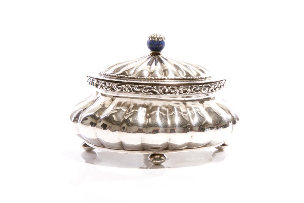 18TH C AUSTRIAN SILVER SUGAR BOWL, 362g: With hinged dome lid and lapis lazuli finial, the body and lid with matching fluted chased decoration and a border with scrolling foliage. Raised on four button feet. Hallmarked to lid and base with C