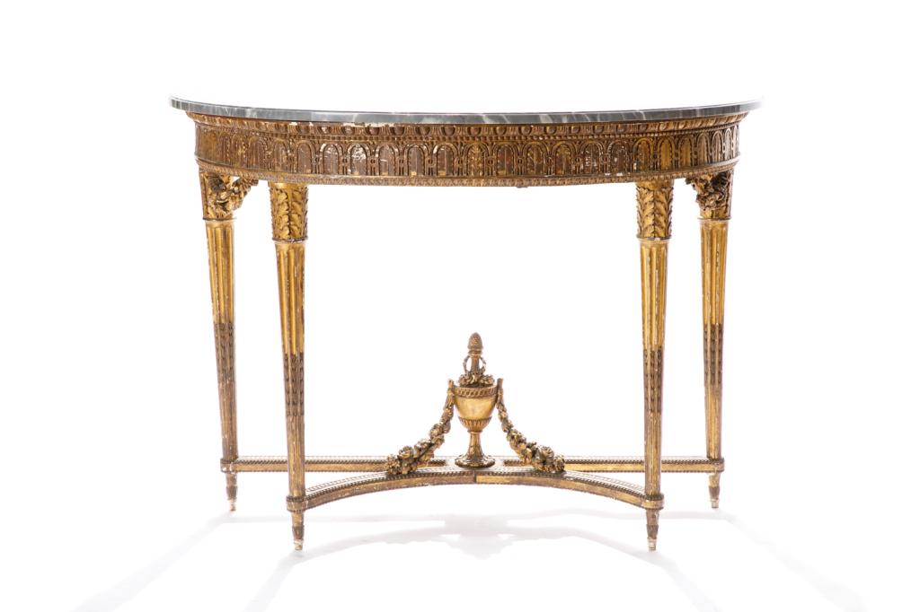 ANTIQUE FRENCH MARBLE TOP CONSOLE TABLE: Heavily carved giltwood base with acanthus apron and capped tapering and reeded legs, x-form base terminating to an urn-form and swag detail, grey marble top, early 19th C. H. 34 x W. 46 1/2 D. 21 in.