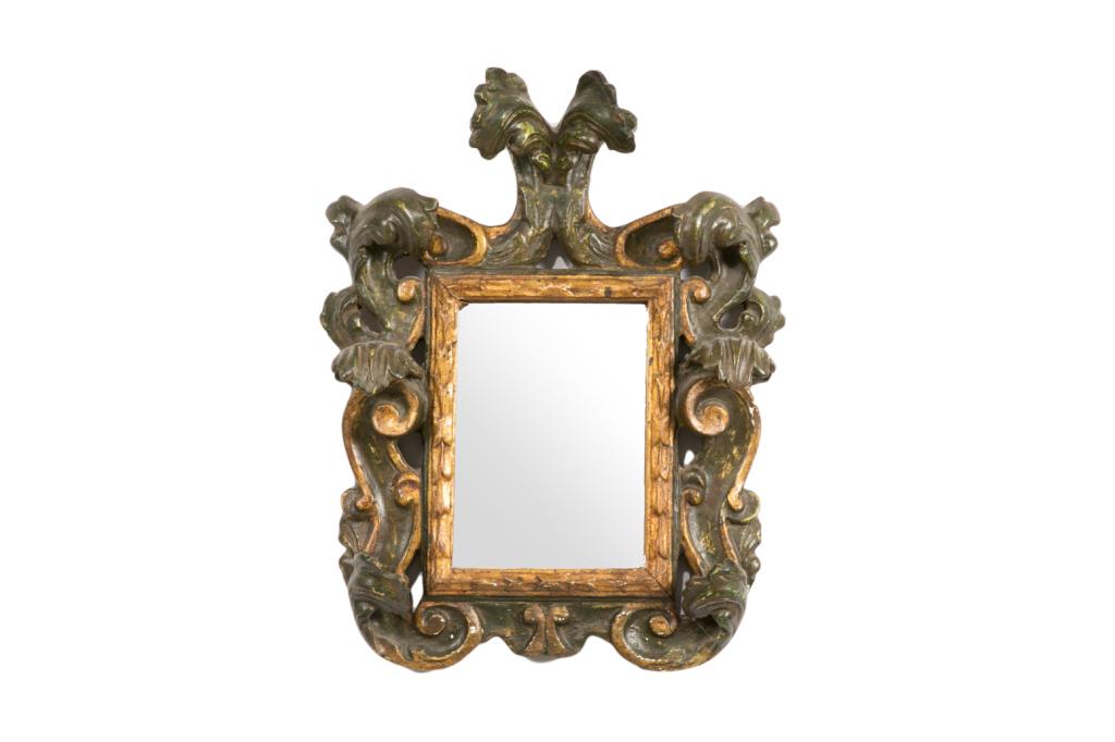 ANTIQUE ITALIAN PAINTED & CARVED GILTWOOD MIRROR: Heavily carved Italianate painted and gilded wood frame in foliate pattern. 19th c or earlier.H. 47 cm (18 1/2 in) W. 35 cm (13 3/4 in) D. 12 cm (4 3/4 in)