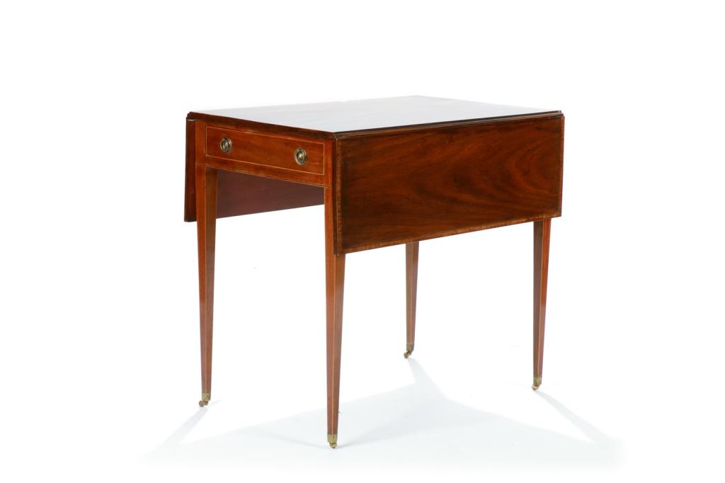 ENGLISH GEORGE III MAHOGANY PEMBROKE TABLE: Rectangular with straight tapered legs terminating in castors. Two drop-leafs and one drawer with false drawer on other side for symmetry. With satinwood banding and brass pulls. Late 18/early 19th C.