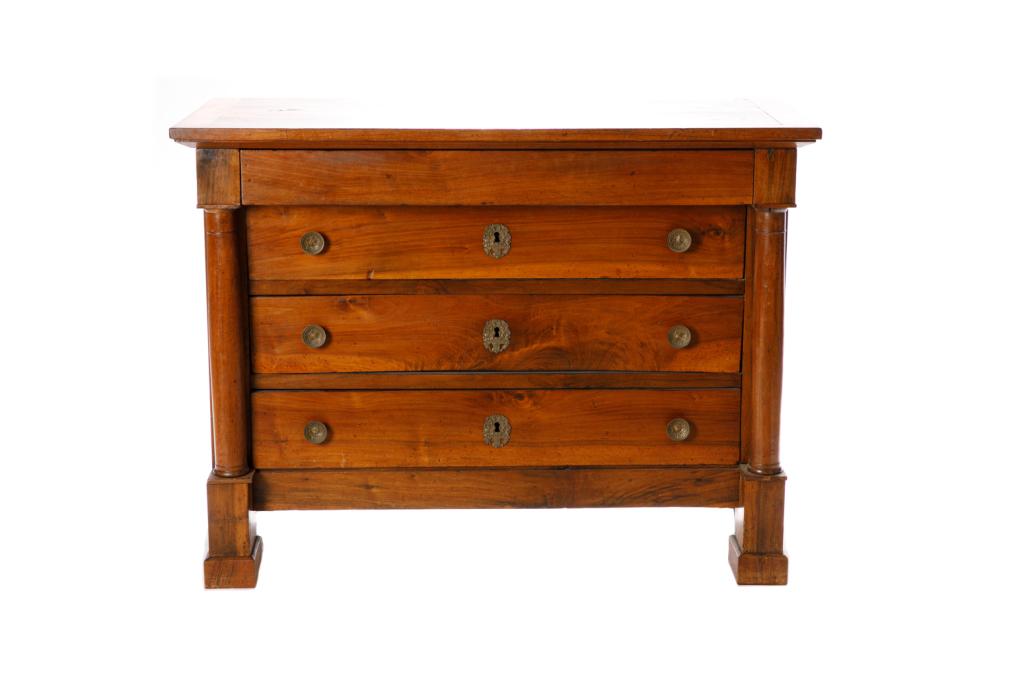 FRENCH ROSEWOOD FOUR DRAWER CHEST: Heavy squared legs, column side supports with brass pulls and escutcheons, 19th C. H. 35 1/2 x W. 47 3/4 x D. 23 1/4in