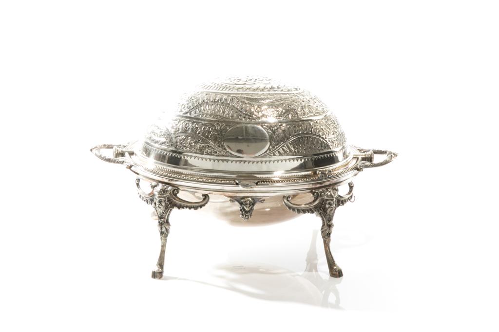 ENGLISH SILVER PLATED REVOLVING BREAKFAST TUREEN: The domed lid with engraved fern design, raised on grotesque capped hoof feet. WH makers mark, early 20th C. W. 38cm (15 in.)