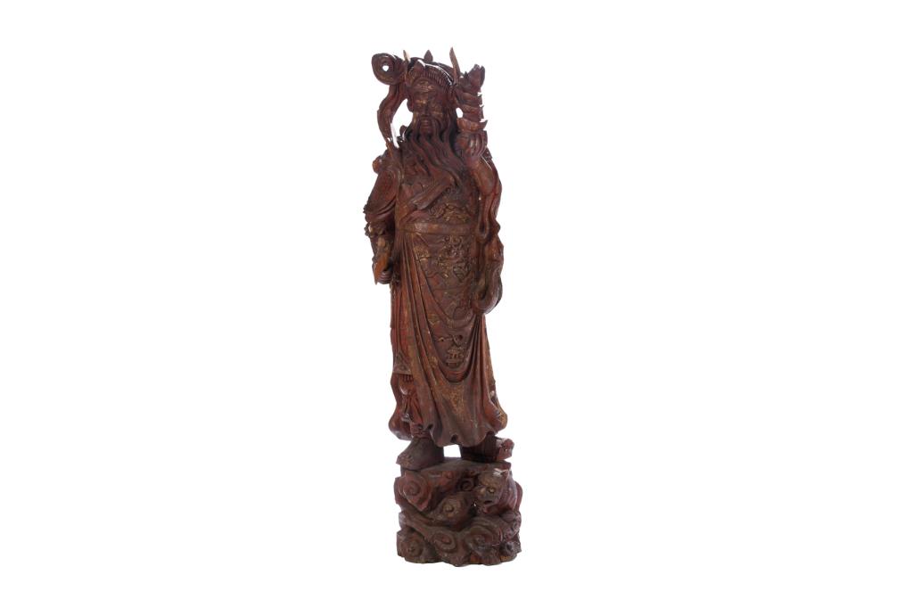 MASSIVE CHINESE GILT & LACQUERED WOOD WARRIOR: Carved as wearing Ming dynasty style amour, holding ingots in left hand and weapon in right. Qing dynasty. H. 182cm (71 1/2 in.)