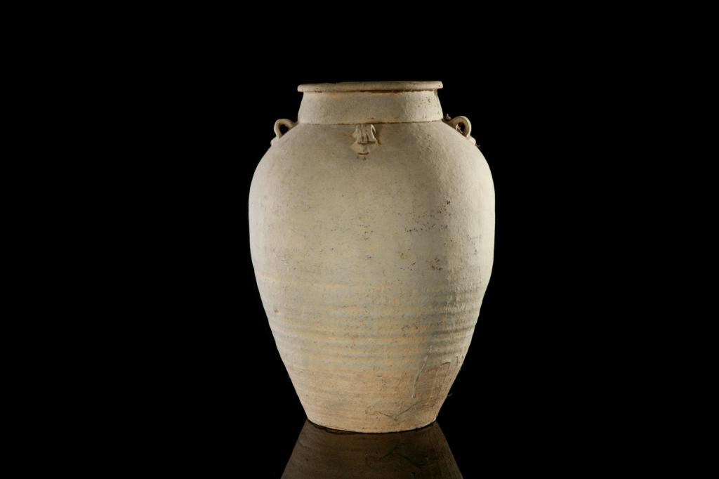 LARGE CHINESE STRAW GLAZED AMPHORA: Melon form body with a neck waisted neck one side with a curved and elongated spout, the opposing side with a strap handle. Two further small loop handles. Song dynasty. H. 22.3cm (8 3/4 in.) Provenan