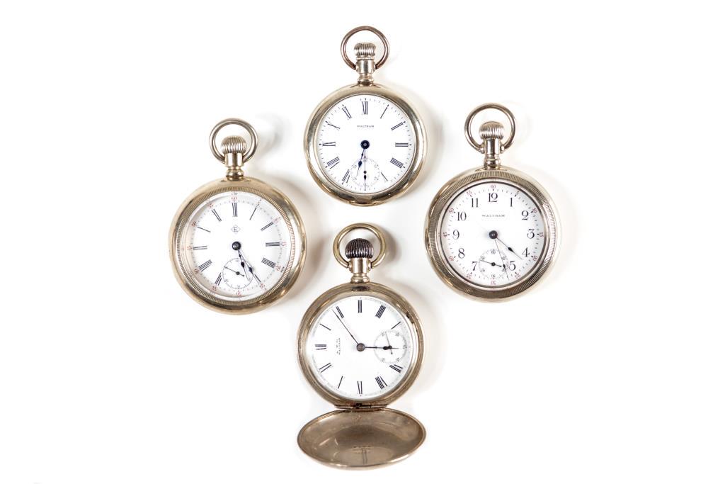 FOUR ANTIQUE POCKET WATCHES: Three American and one Canadian by Eaton's. All in nickel cases.