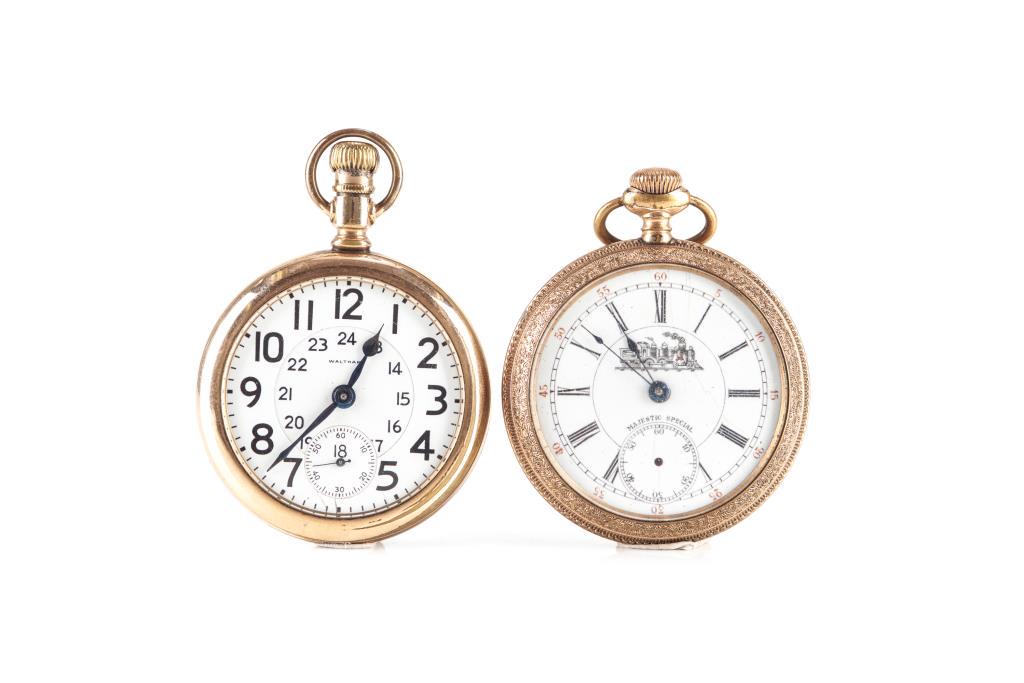 TWO ANTIQUE RAILROAD WATCHES: Open face, gold filled Canadian Waltham 645. 21 jewels, 5 adjustments, c.1910. 99g t.w. Dia. 5.1 cm (2 in.). Together with a Swiss Majestic Special gold plated, ornate detailing around the outer edges