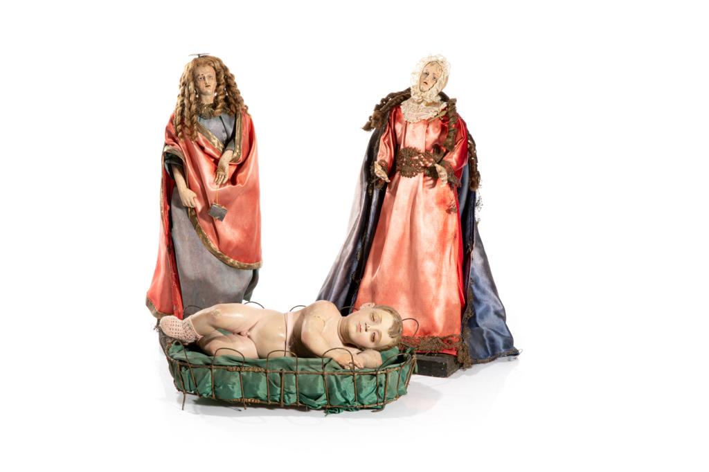 THREE CONTINENTAL POLYCHROME WOOD CRIB FIGURES: Wood and gesso crib / santos figures. Probably Italian, Naples, 18th C. Satin clothing is likely a later addition. Together with an Italian crib figure of the infant Jesus. H. of tallest: 45 cm ( 17 3