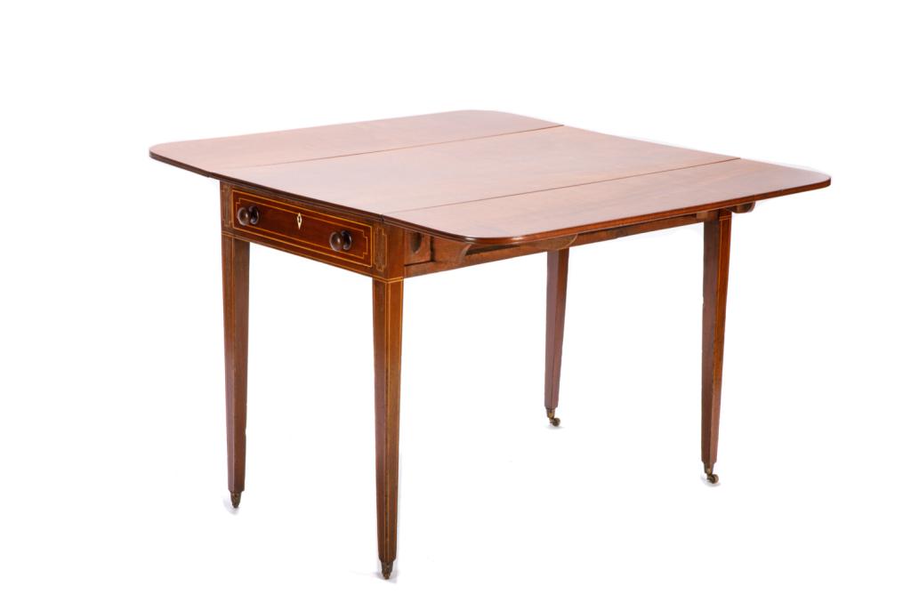 GEORGE III MAHOGANY DROP LEAF TABLE: A fine single board top Pembroke table, with satinwood inlay and a single flatware drawer with an escutcheon of natural materials. Four tapered legs on casters. H. 72 cm (28 3/8 in) W. (not including